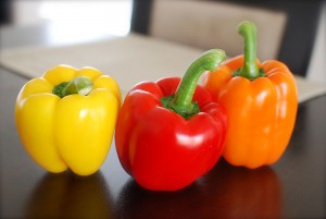 yellow red and orange capsicum (bell peppers)