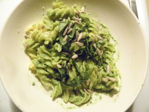 fusilli gluten free pasta mixed with lemon pesto and sprinkled with sunflower seeds