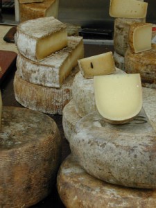 cheese wheels at a market in Basel