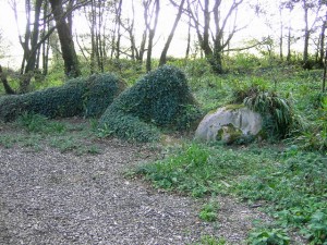 sleeping statue covered with grass