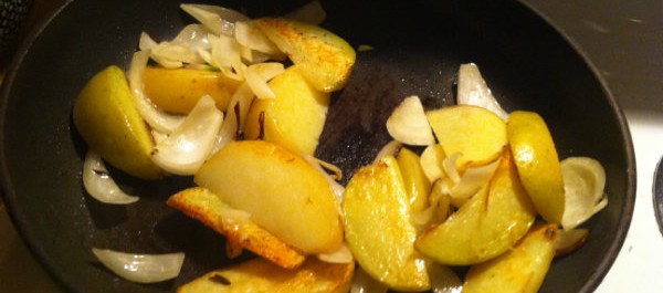 potatoes and onions on fry pan