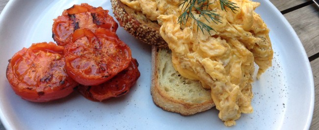 Scrambled eggs and grilled tomato