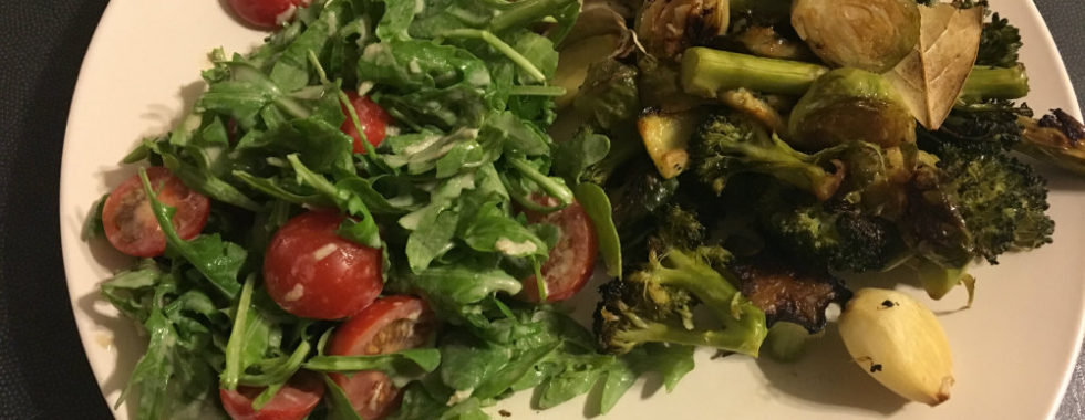 plate filled with veges and salad and a little roast chicken