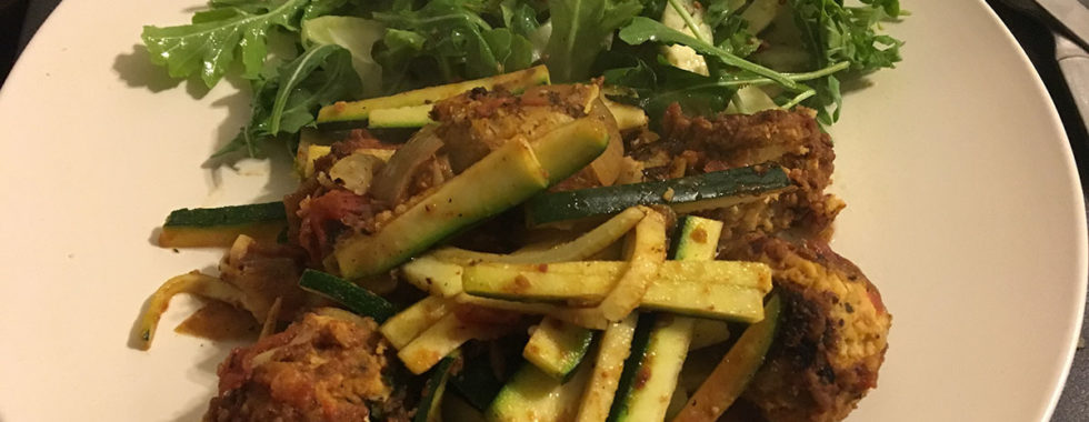 plate of salad, meatballs and zucchini 'pasta' for a low carb vegetarian dinner